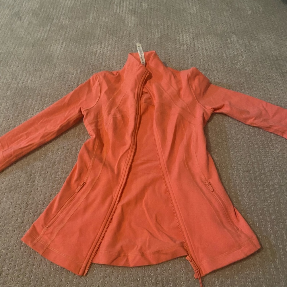 Size 4 Lululemon raspberry cream define jacket never been worn. NWOT.